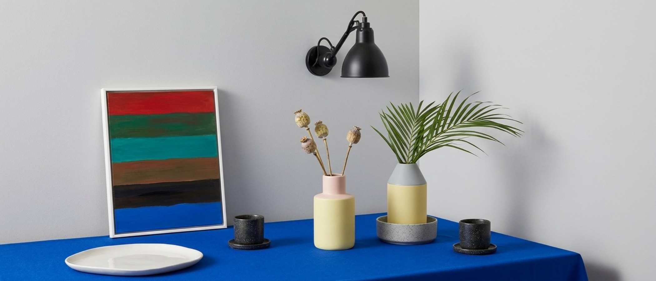 Articula foldable swing arm wall light in a styled room