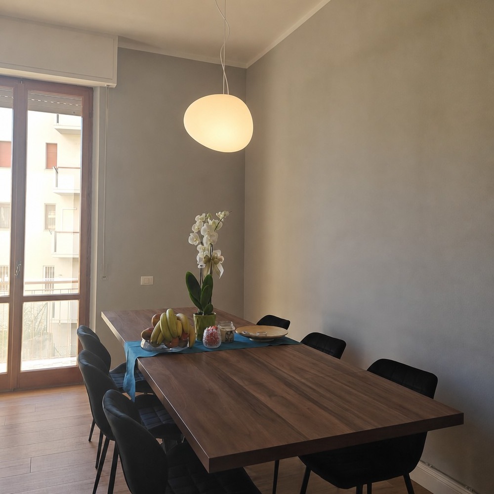 Stonea pendant light installed above dining table