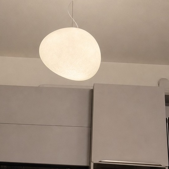 Stonea pendant light glowing in room