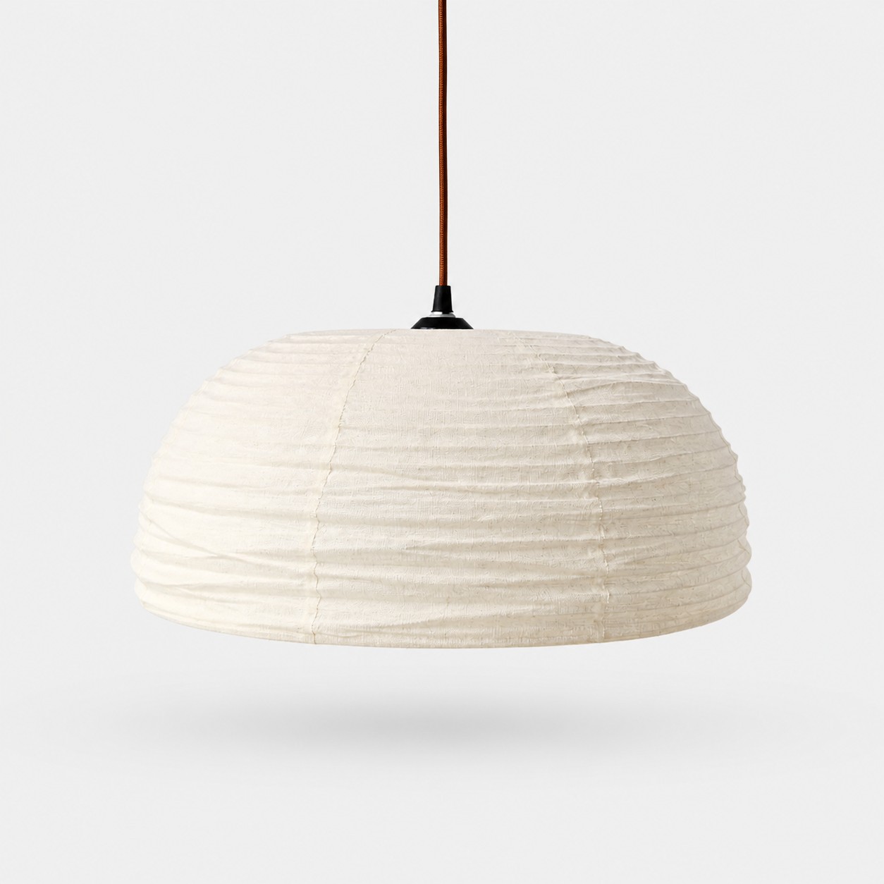 Ivory gathered fabric pendant lamp on white background