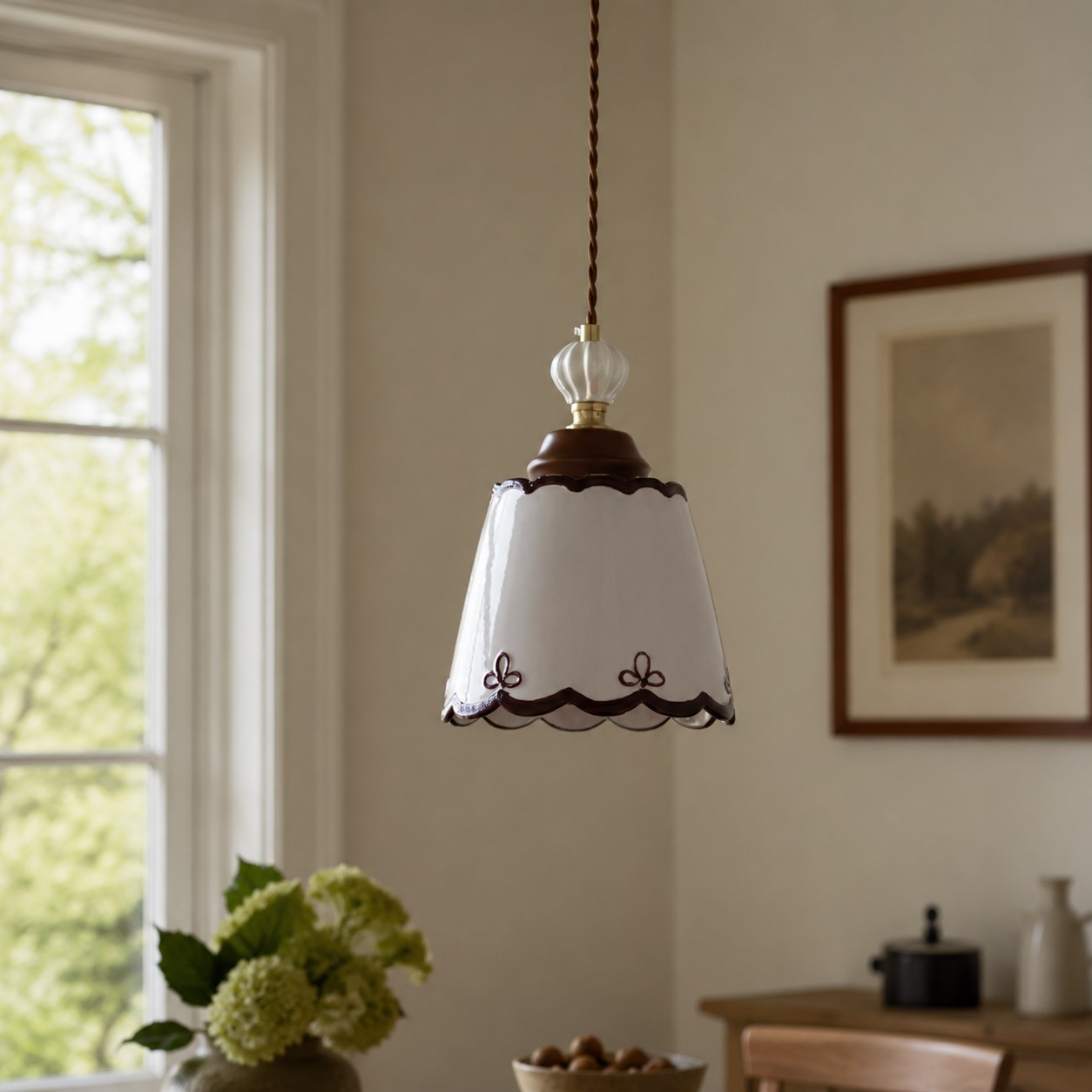 single ceramic pendant light in a warm dining corner