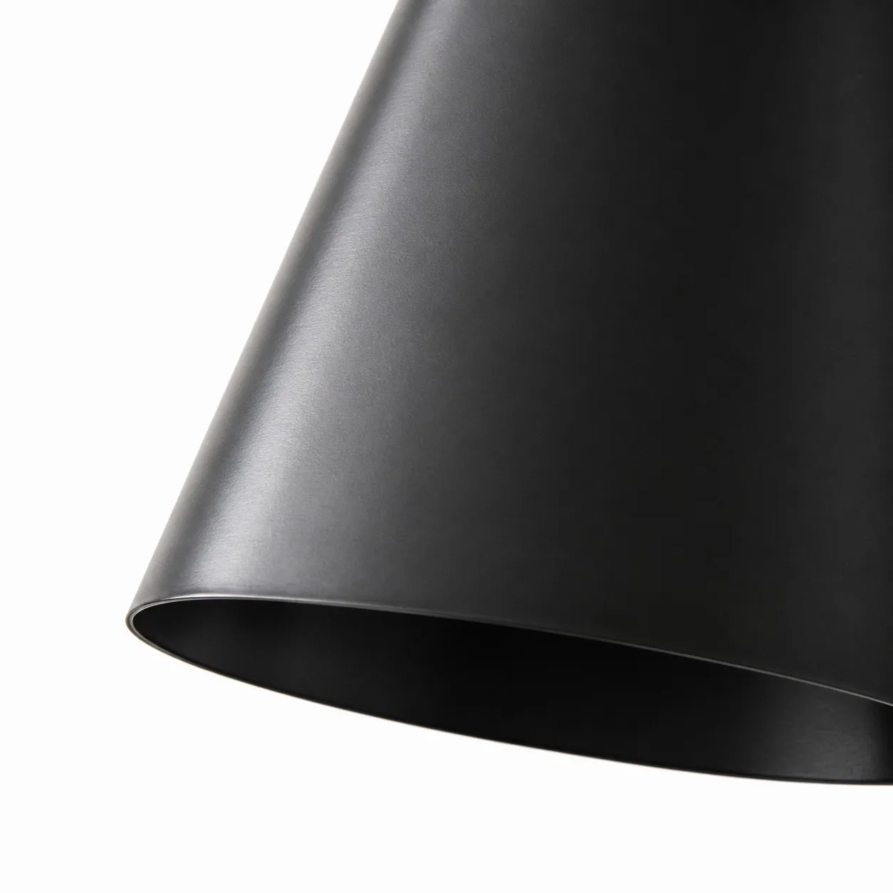 Close-up of matte black cone shade rim