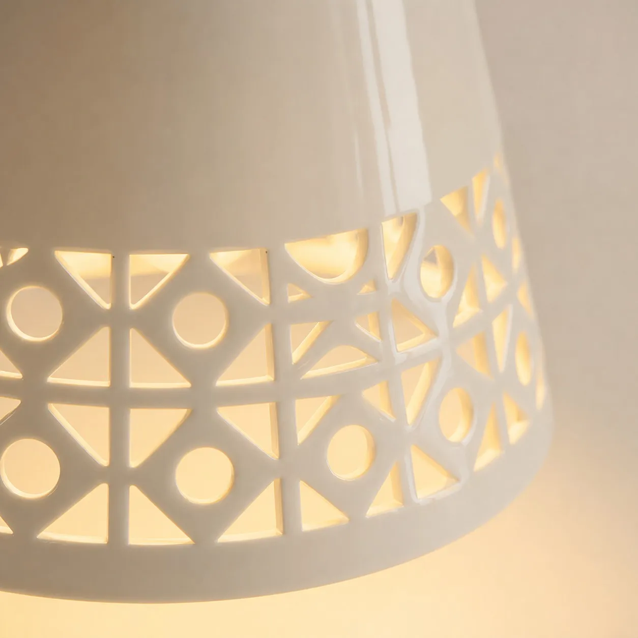 close view of cutout ceramic shade edge and warm glow