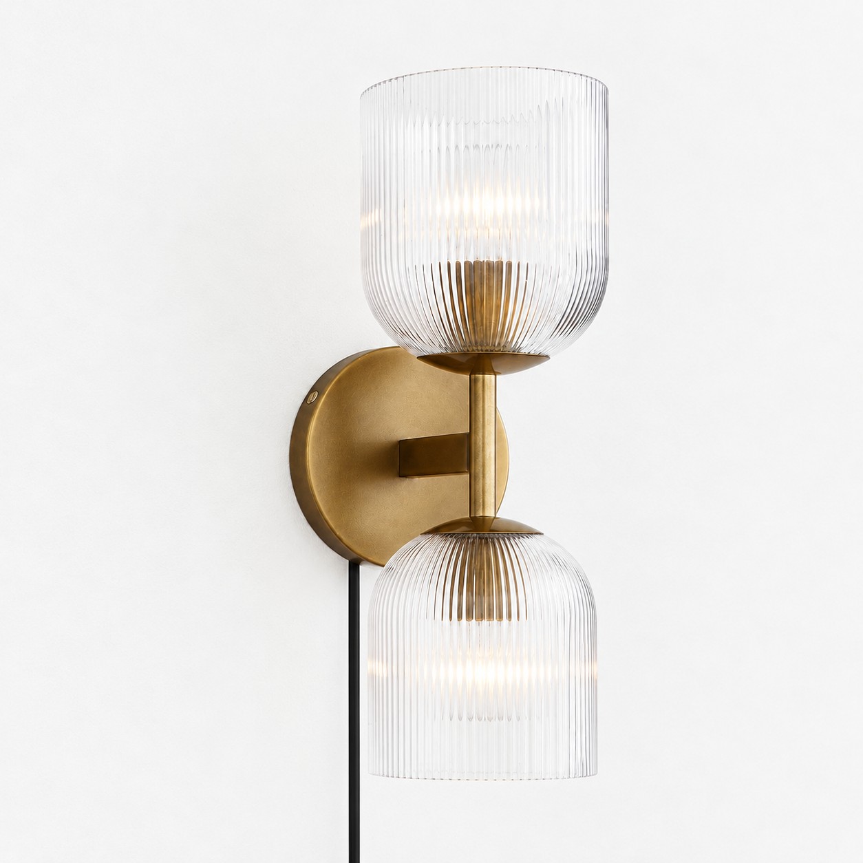 Tumbled brass ribbed-glass wall sconce, two lights