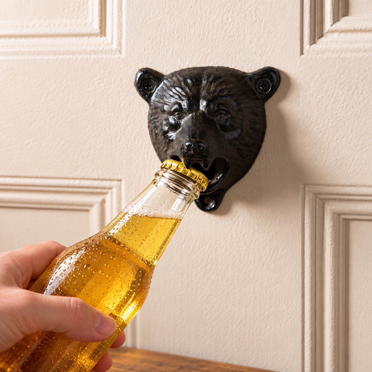 Opening a bottle with the wall-mounted bear
